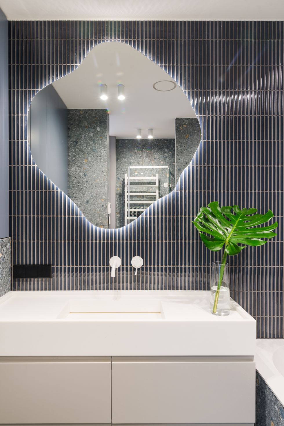 modern bathroom with backlit mirror
