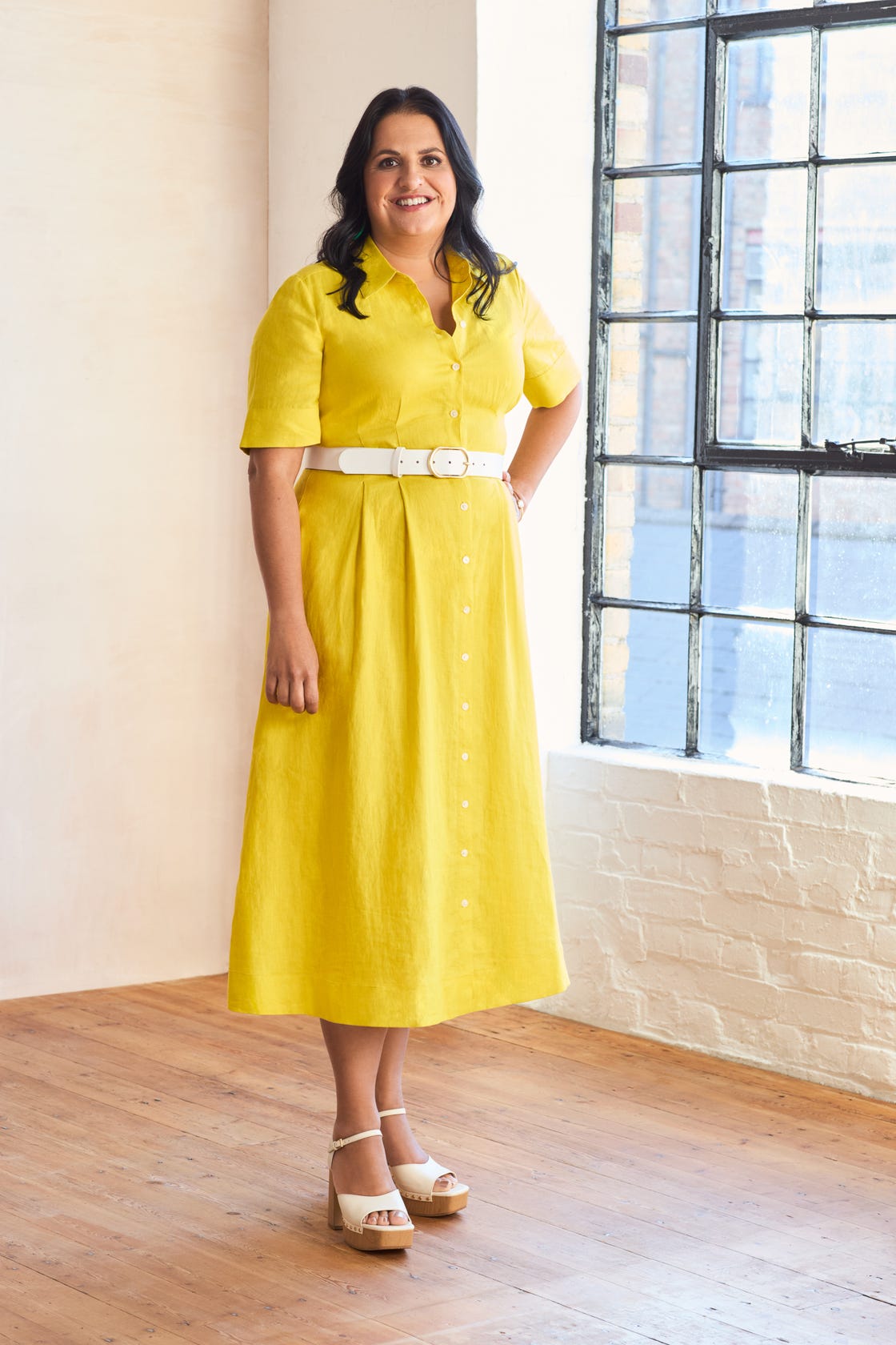 a woman in a yellow dress