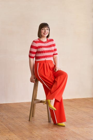 a person sitting on a stool