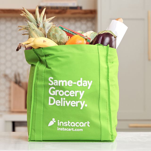 instacart delivery bag full of groceries in kitchen
