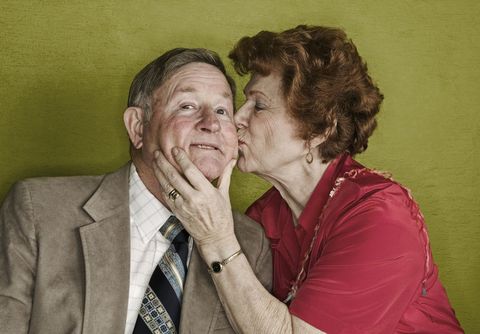 older woman kissing man on cheek