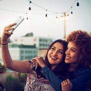 Friends taking a selfie on urban rooftop friends taking a selfie on urban rooftopfriends taking a selfie on urban rooftop