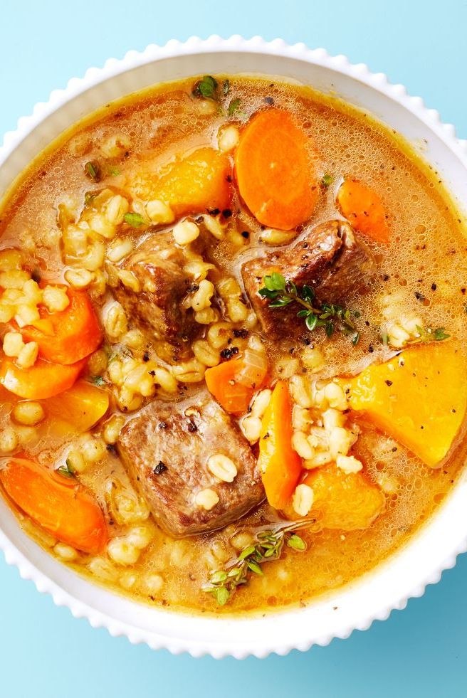 beef and barley stew in a white bowl