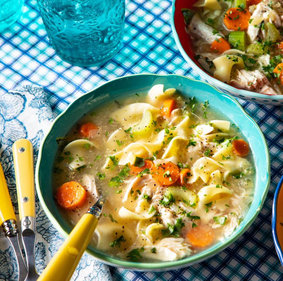 instant pot chicken noodle soup with carrots celery onions noodles and fresh herbs