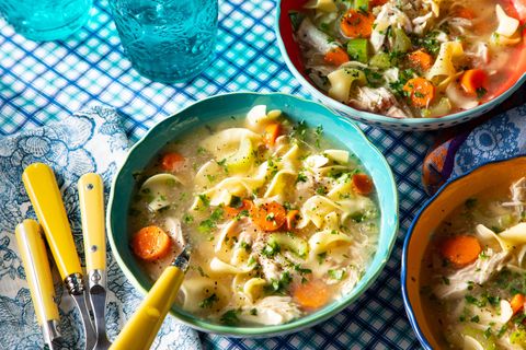 instant pot chicken noodle soup with carrots celery onions noodles and fresh herbs