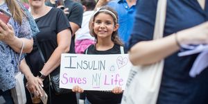 windsor, on   july 28  a girl holds a sign that reads "insulin saves my life" while democratic presidential candidate, us sen bernie sanders d vt talks about the cost of insulin in the usa versus canada as he joins a group of people with diabetes on a trip to canada for affordable insulin on july 28, 2019 in windsor, canada  the democratic presidential candidate is traveling to canada to raise awareness around rising insulin prices in the united states photo by scott eisengetty images