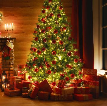 interior christmas magic glowing tree fireplace gifts in  dark