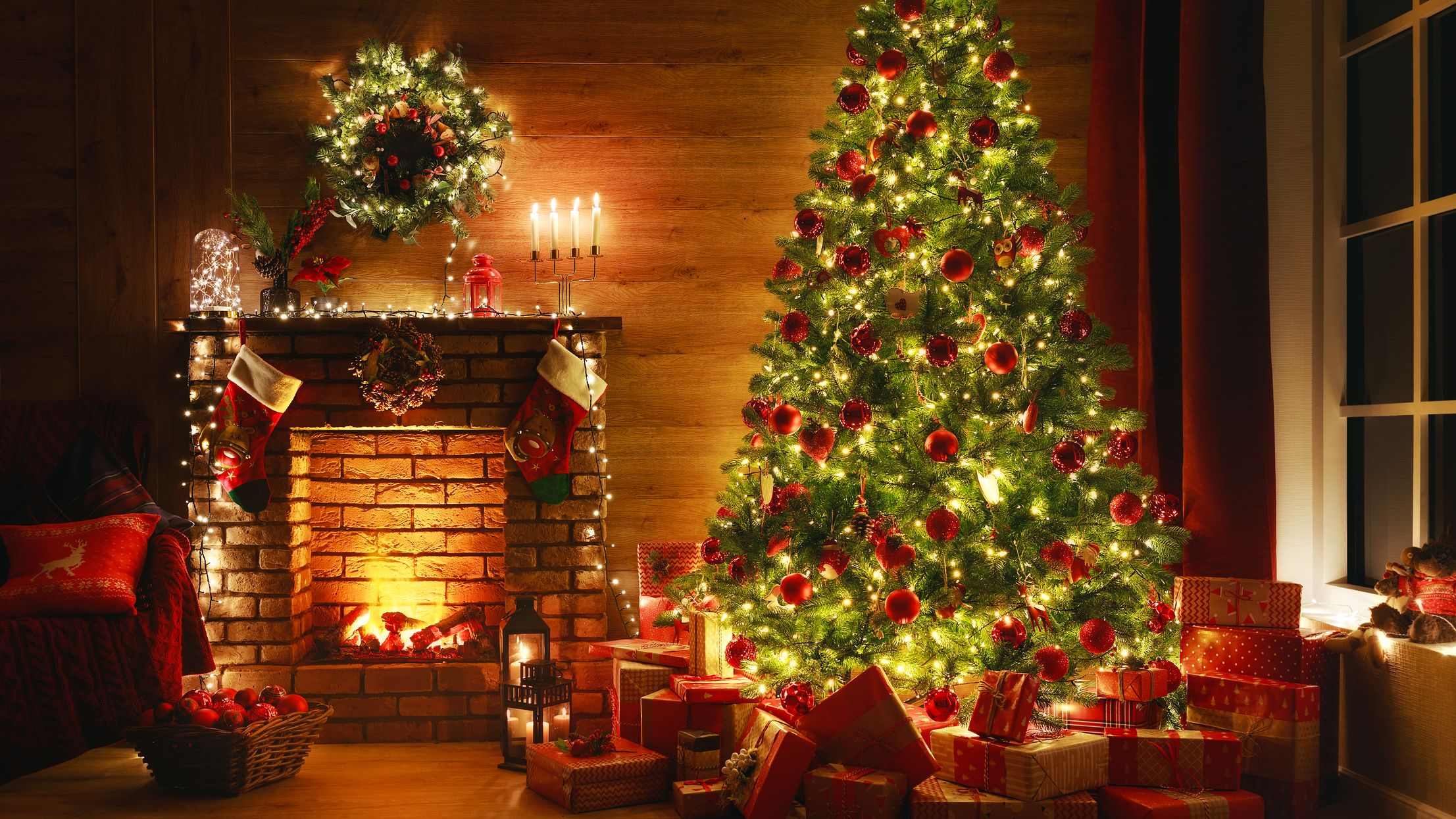 https://hips.hearstapps.com/hmg-prod/images/interior-christmas-magic-glowing-tree-fireplace-royalty-free-image-1628537941.jpg?crop=1xw:0.91898xh;center,top
