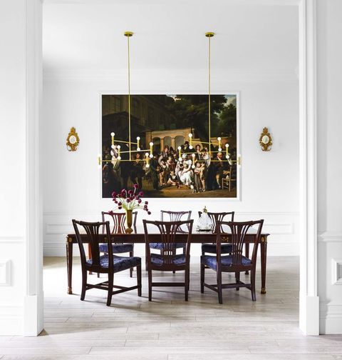 modern dining room with classic furniture and painting