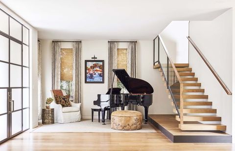 entryway with grand piano