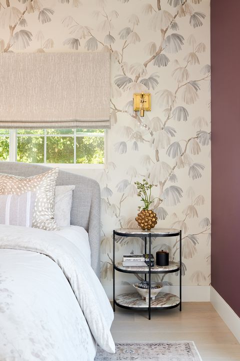 bedroom with purple wall and floral wallpaper accent wall
