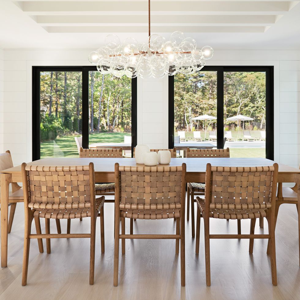 white dining room with woven back chairs