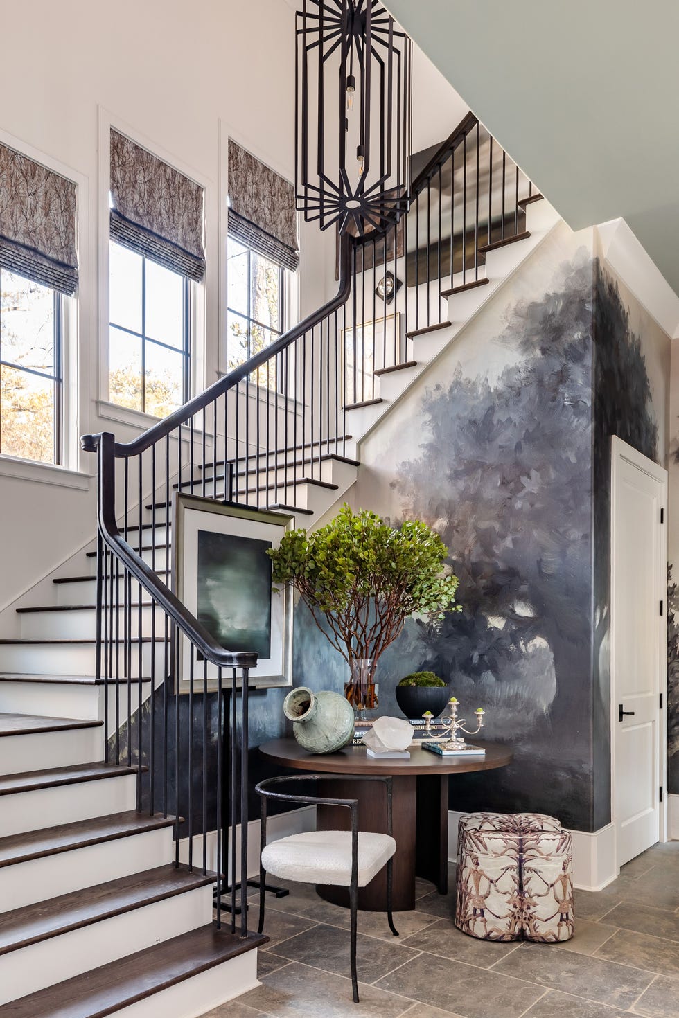 a staircase with a table and chairs