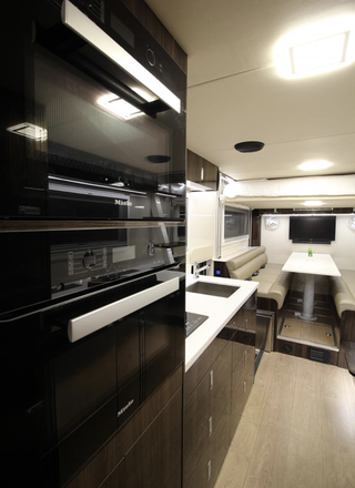 kitchen and dining area of a luxury camper