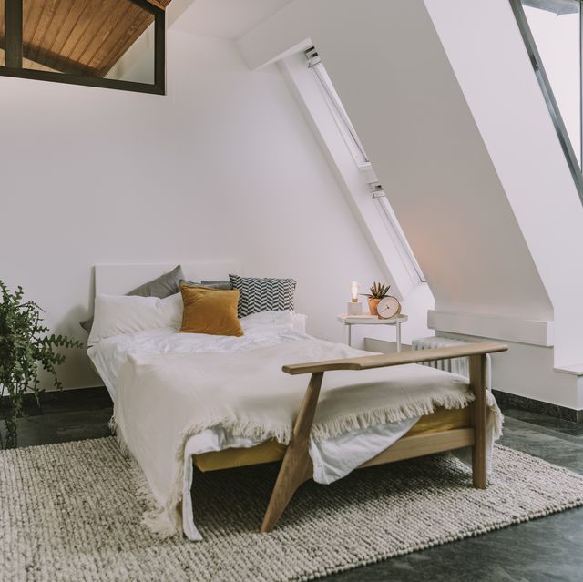 https://hips.hearstapps.com/hmg-prod/images/interior-of-bedroom-in-loft-apartment-royalty-free-image-1657905753.jpg?crop=0.668xw:1.00xh;0.167xw,0&resize=640:*