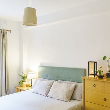 interior of white bedroom with furniture
