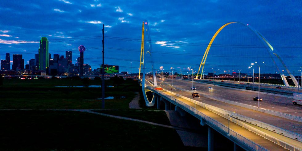 interstate 30 leads to downtown dallas, texas at dusk featuring margaret hill bridge