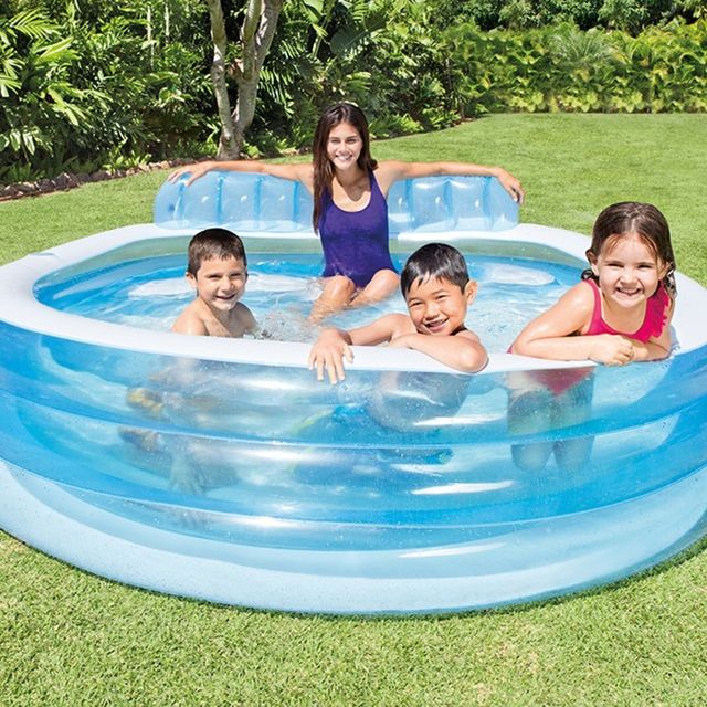 4 kids in an inflatable intex family swim center pool