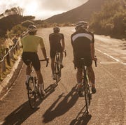 three road cyclists riding in a group