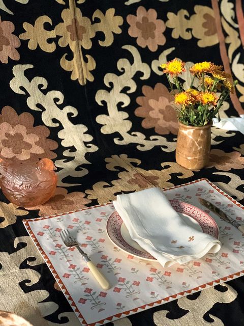 a placemat and tablecloth with a neutral color palette