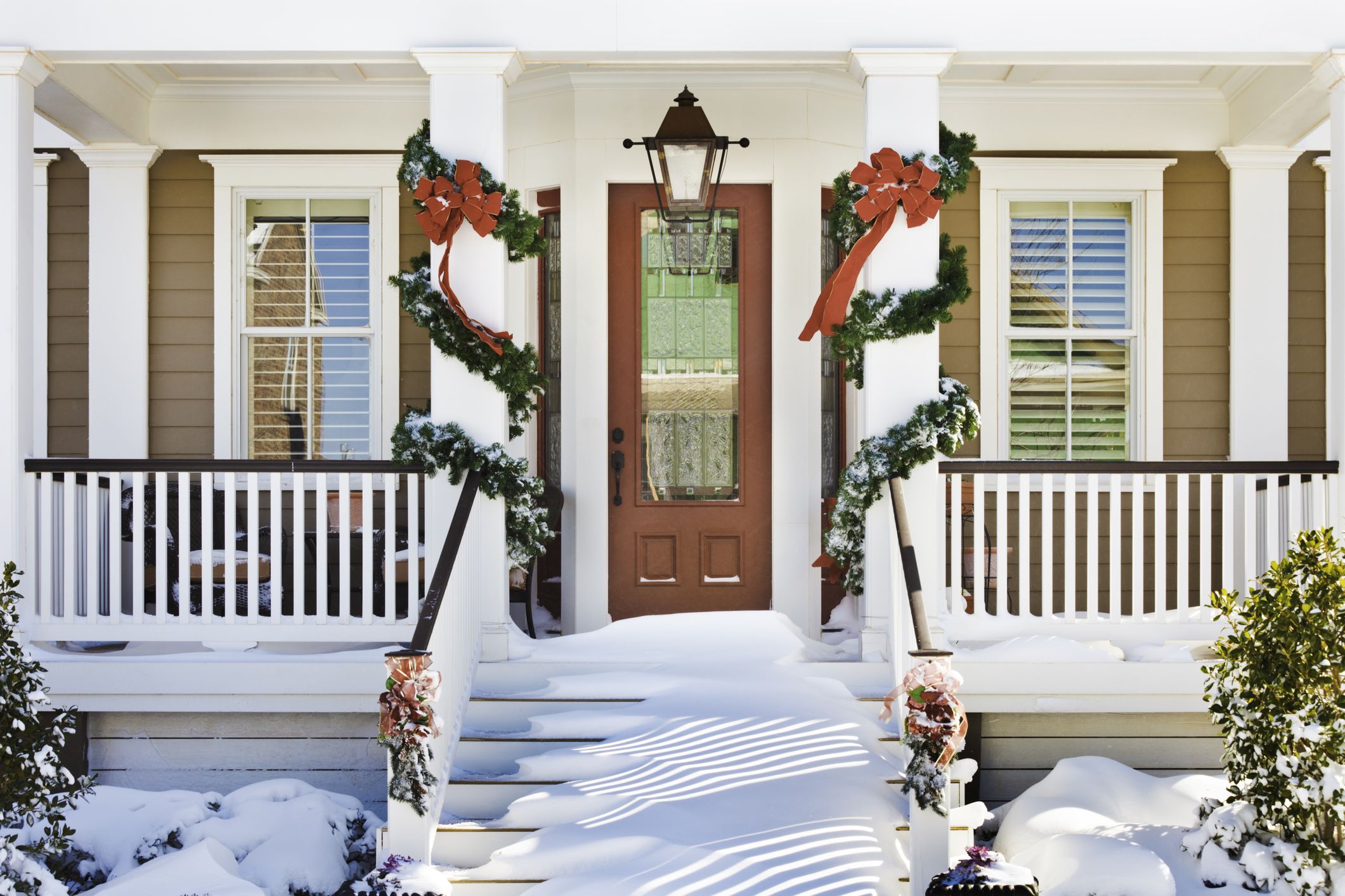 Inviting Christmas Front Doorway With Snow On Porch Royalty Free Image 1692027101 