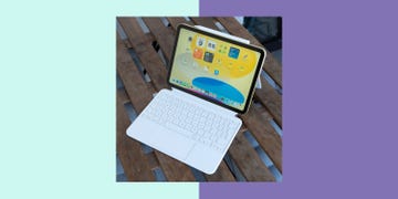 tablet with keyboard on a wooden surface displaying an app interface
