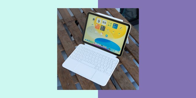 tablet with keyboard on a wooden surface displaying an app interface