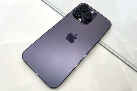 three camera lenses on purple iphone 14