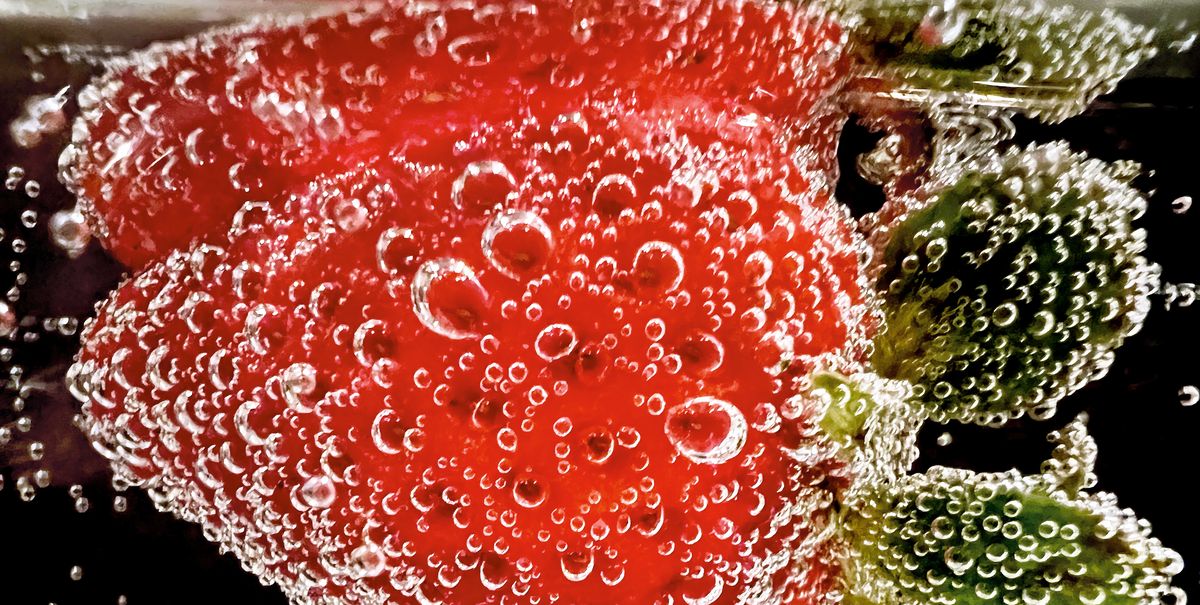 strawberry submerged in soda