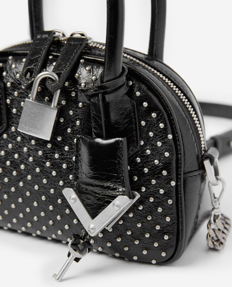 Bag, Handbag, Fashion accessory, Hand luggage, Black-and-white, Design, Pattern, Shoulder bag, Material property, Font, 