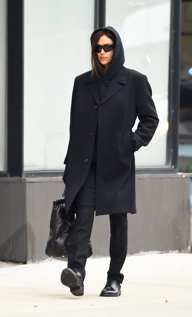 Irina Shayk Layers a Distressed Leather Jacket over a Long Trench Coat