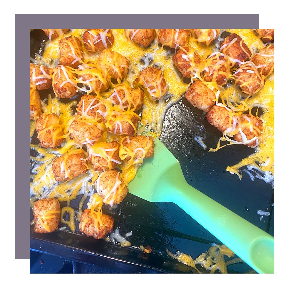 cheesy tater tots cooking in iris air fryer
