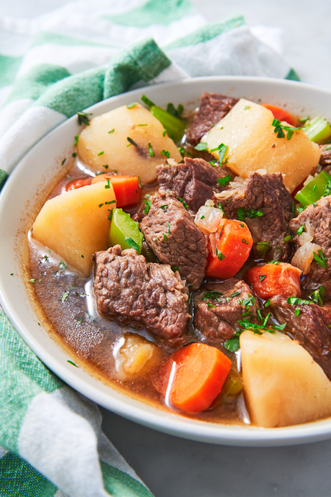 irish beef stew with carrots and potatoes in a white bowl