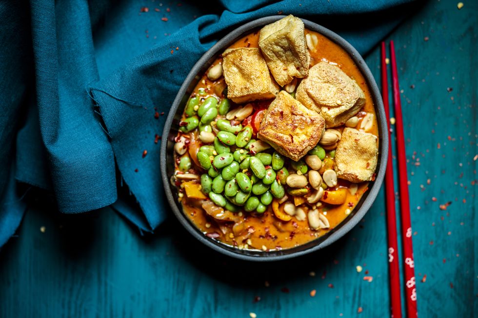 bowl of ready to eat vegan curry with edamame and tofu