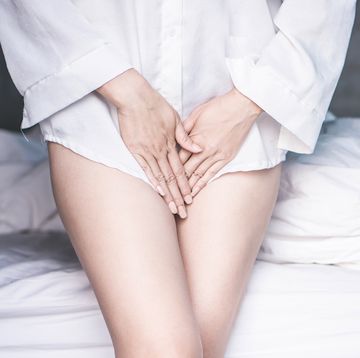 woman holding her crotch to illustrate having an itchy vulva