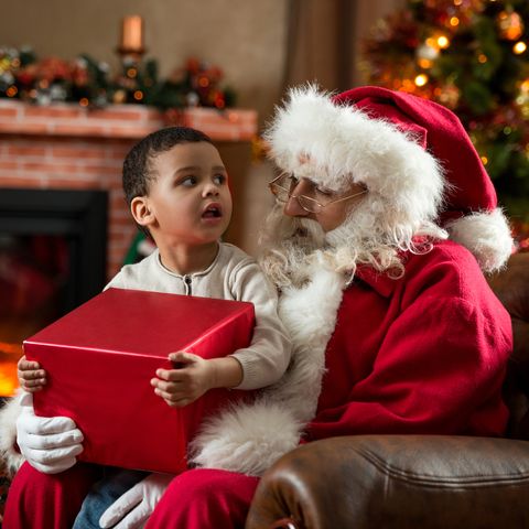 is santa claus real, photo of child on santa's lap