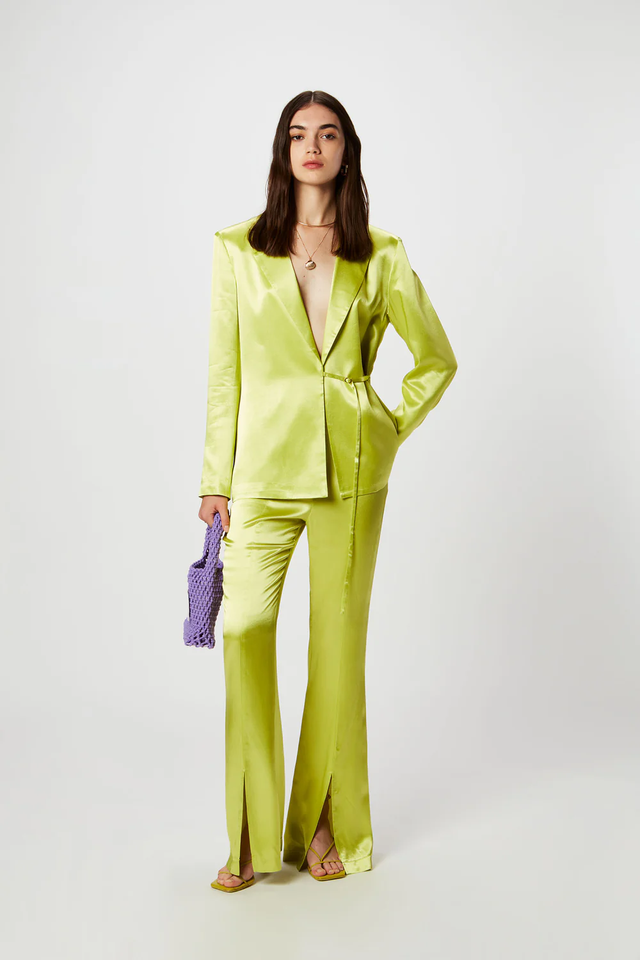 a woman in a yellow suit