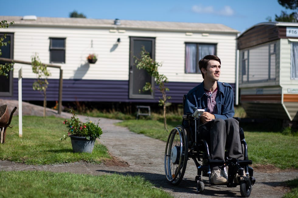Wheelchair, House, Home, Real estate, Vehicle, Sitting, Yard, Lawn, Residential area, Building, 