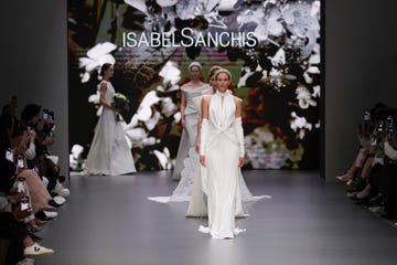 a group of women in white dresses