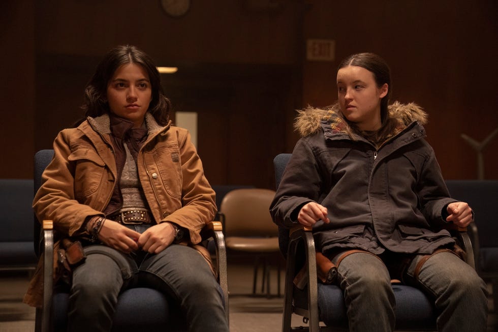 two individuals seated in a waiting area