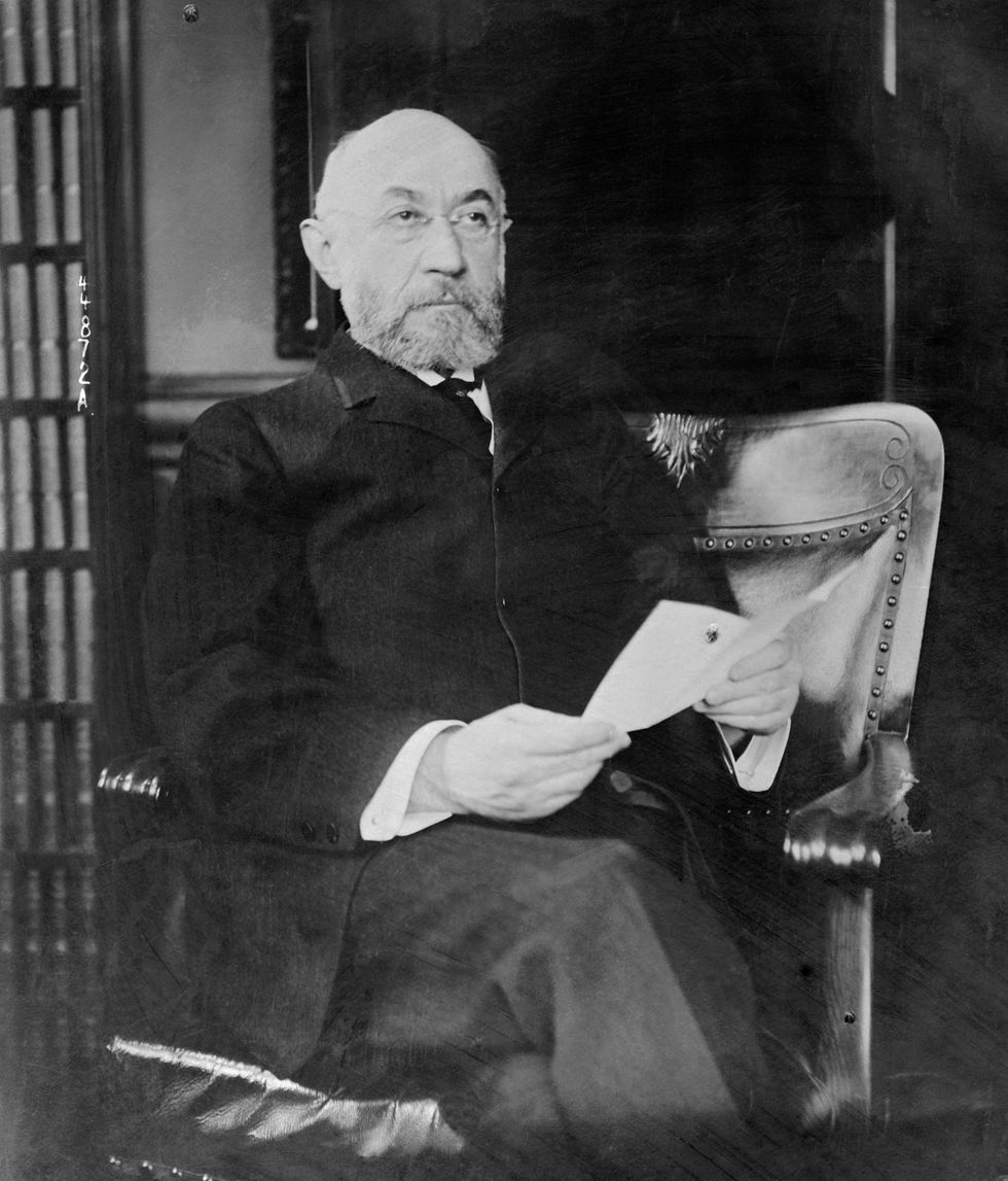 isidore straus shown seated alone