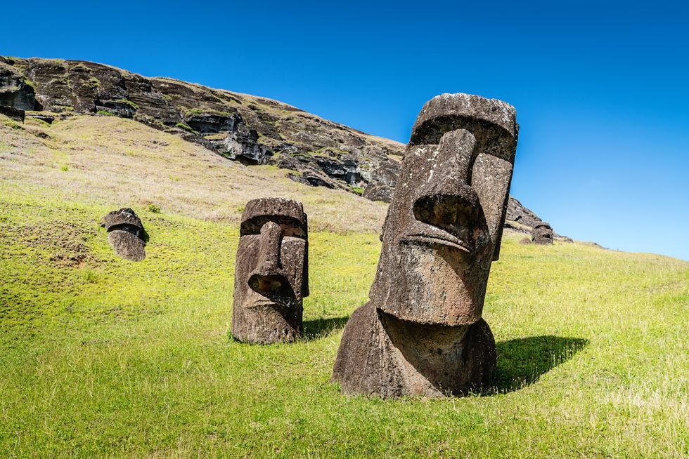 easter island moai statues at rano raraku under sunny summer sky rano raraku, rapa nui national park, hanga roa, easter island, chile