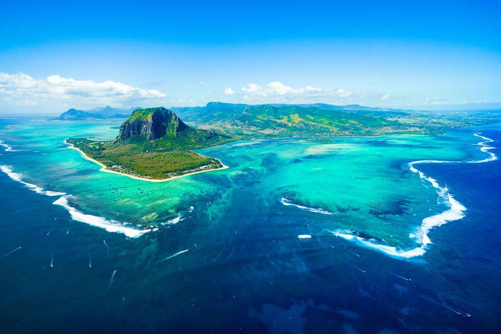 aerial view of mauritius island panorama and famous le morne brabant mountain, beautiful blue lagoon and underwater waterfall