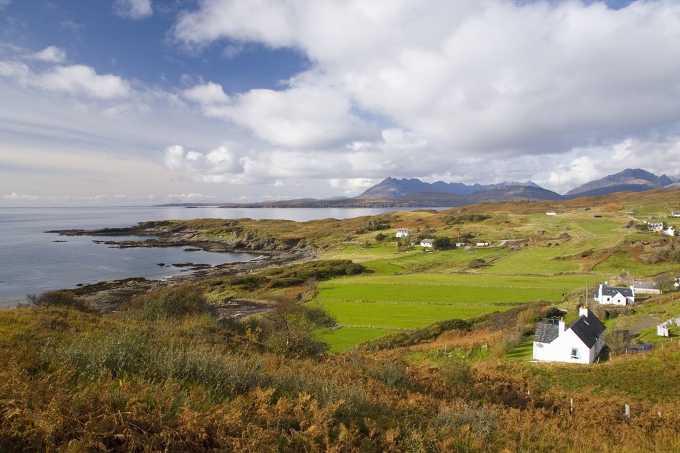 the cuillin hills, widely regarded as britains most spectacular mountain range, dominate the isle of skye the village of tarskavaig on the sleat peninsula affords a fine view of the range