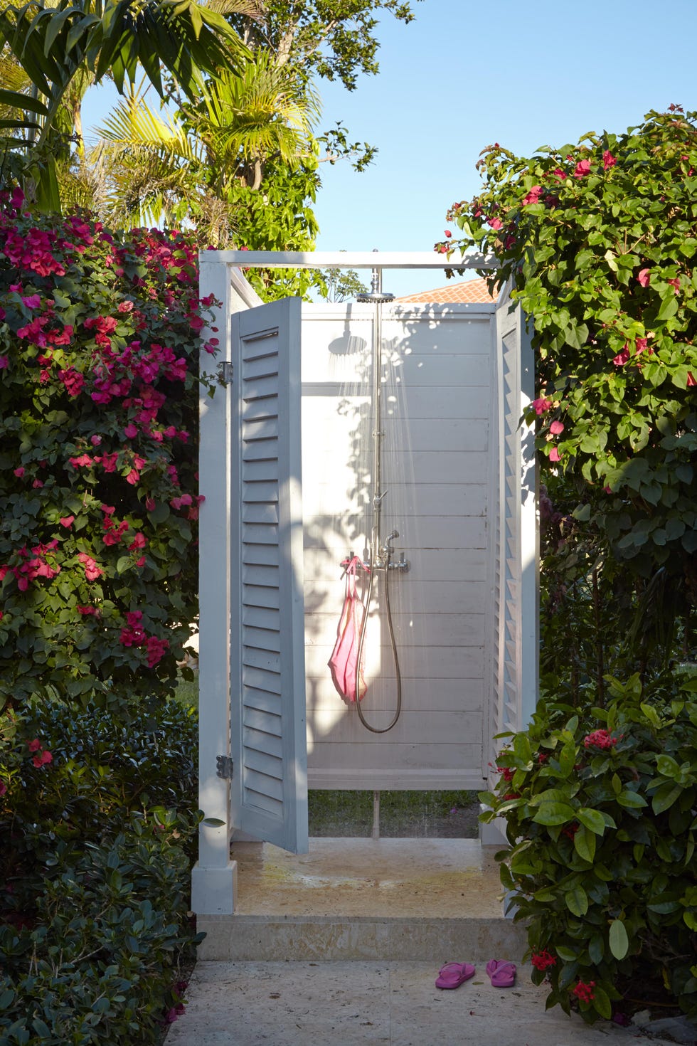 a white enclosed outdoor shower