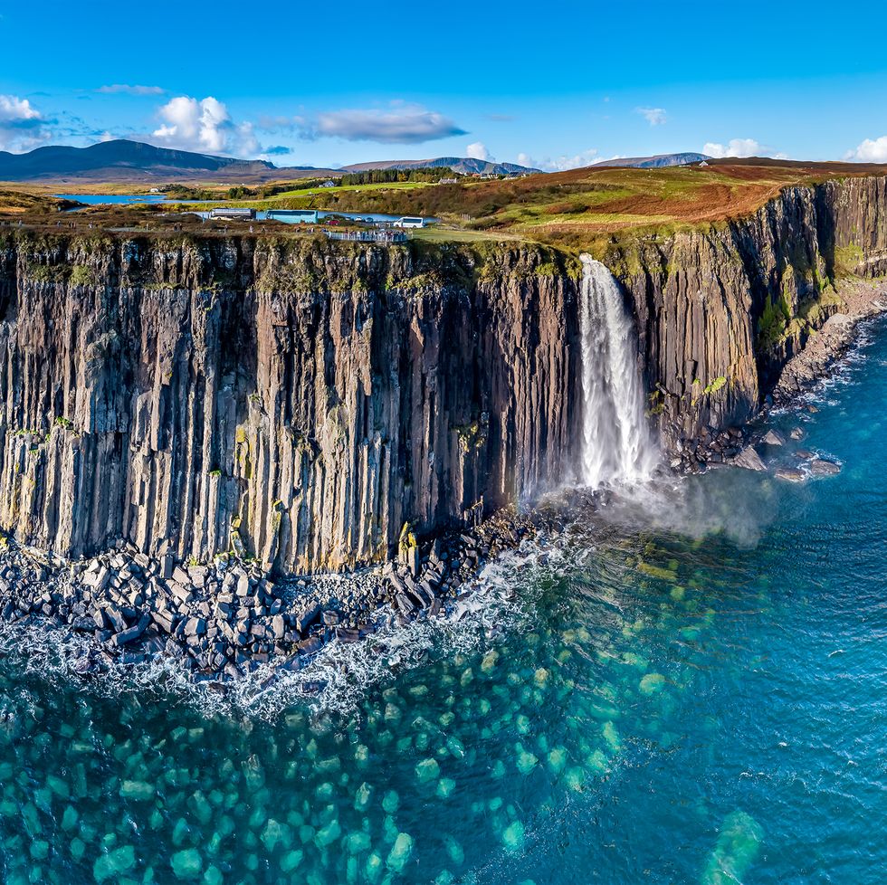 aerial view of the dramatic coastline at the cliffs by staffin with the famous kilt rock waterfall   isle of skye   scotland