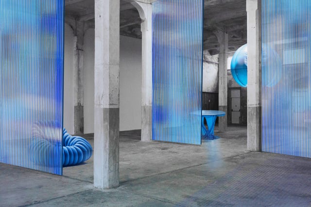 a blue chair in a room