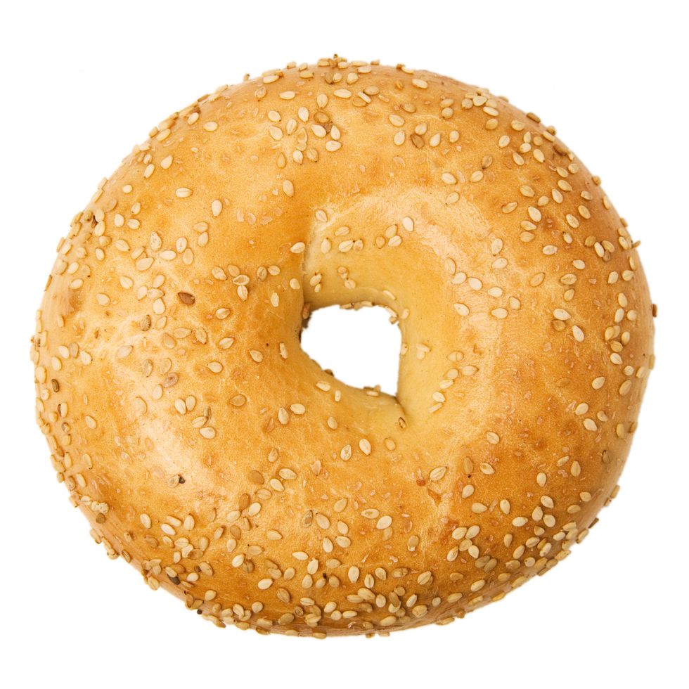 isolated close up of of sesame bagel on a white background