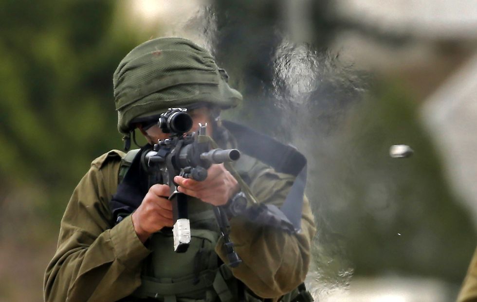 an israeli soldier fires rubber bullets at palestinian protesters during a weekly demonstration against the expropriation of palestinian lands in the village of kfar qaddum, near nablus in the occupied west bank, on february 1, 2019 photo by jaafar ashtiyeh  afp  correction the erounous byline appearing in the metadata of this photo is  by jaafar ashtiyeh  instead of  abbas moumani  and the erounous caption has been modified in afp systems in the following manner an israeli soldier fire rubber bullets at palestinian protesters during a weekly demonstration against the expropriation of palestinian lands in the village of kfar qaddum, near nablus in the occupied west bank, on february 1, 2019  instead of an israeli soldier fires rubber bullets at palestinian demonstrators during a protest against jewish settlements, in al mughayyir village near ramallah, in the israeli occupied west bank, on february 1, 2019     please immediately remove the erroneous mentions from all your online services and delete it them from your servers if you have been authorized by afp to distribute it them to third parties, please ensure that the same actions are carried out by them failure to promptly comply with these instructions will entail liability on your part for any continued or post notification usage therefore we thank you very much for all your attention and prompt action we are sorry for the inconvenience this notification may cause and remain at your disposal for any further information you may require        photo credit should read jaafar ashtiyehafp via getty images