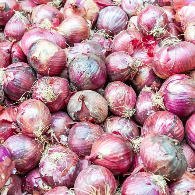 red onions sold at shuk hacarmel market, tel aviv, israel